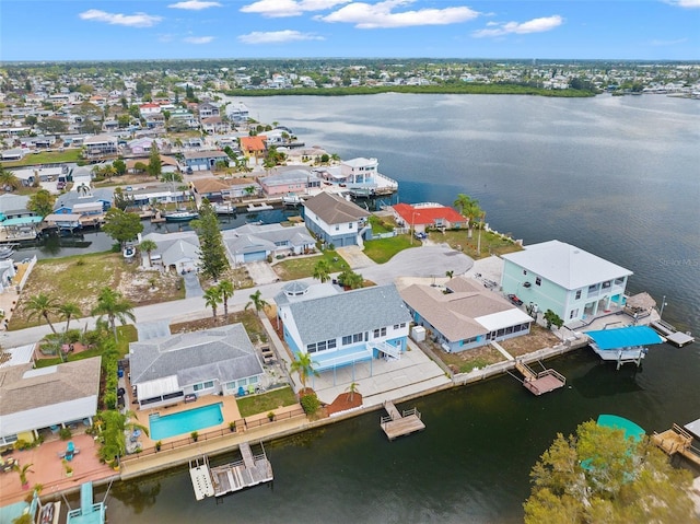 drone / aerial view featuring a water view and a residential view