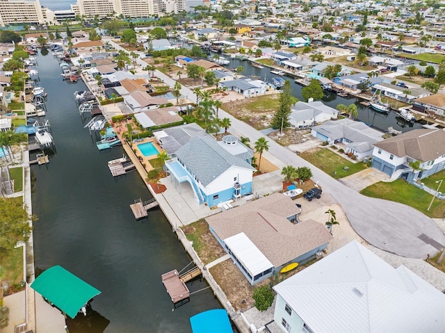 bird's eye view featuring a water view and a residential view