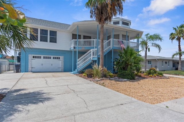 view of front of home featuring a garage and a porch