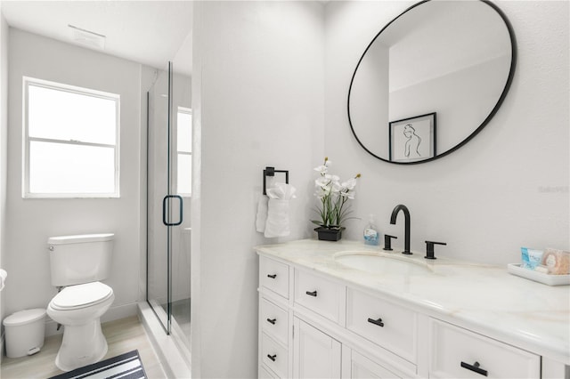 full bath featuring visible vents, toilet, wood finished floors, vanity, and a shower stall