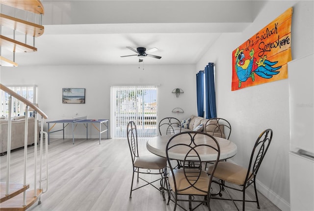 dining area featuring plenty of natural light, baseboards, and wood finished floors