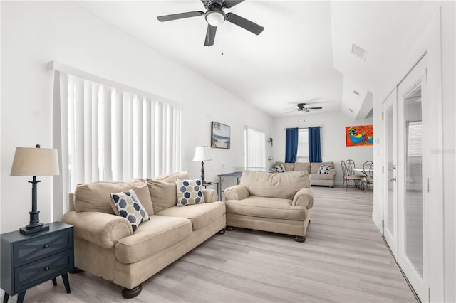 living room with ceiling fan and light wood-type flooring