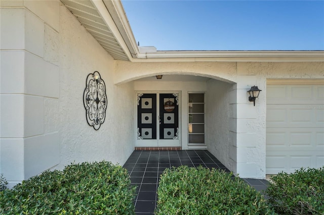 property entrance with a garage