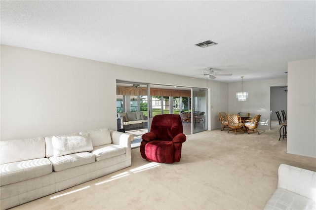 carpeted living room featuring a textured ceiling