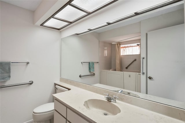 full bathroom with vanity, tiled shower / bath combo, and toilet