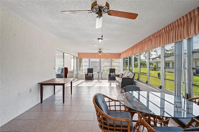 sunroom with ceiling fan