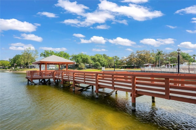 dock area with a gazebo and a water view