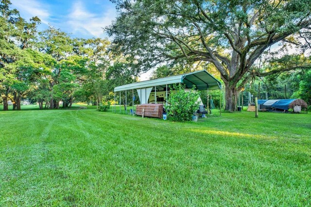 view of yard with a carport