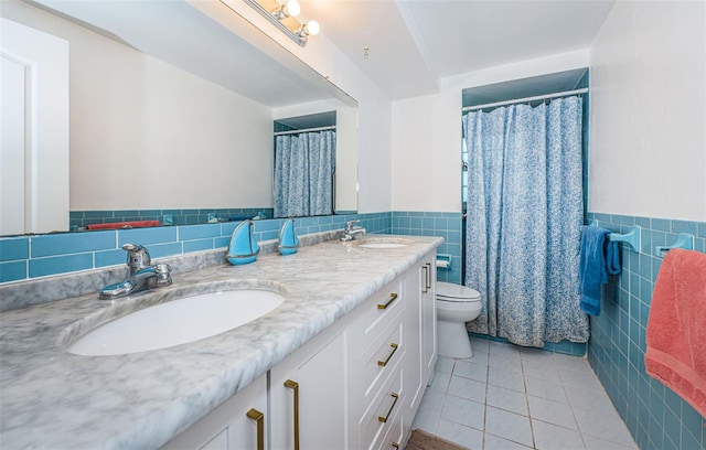 bathroom featuring tile patterned flooring, backsplash, toilet, tile walls, and vanity