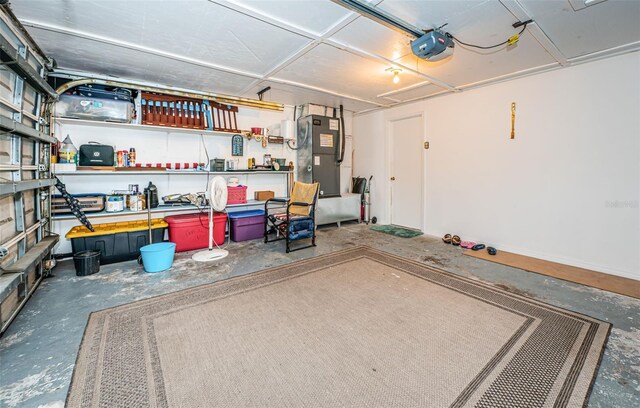 garage with a garage door opener and heating unit