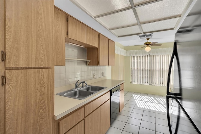 kitchen with stainless steel appliances, sink, light tile patterned flooring, ceiling fan, and tasteful backsplash