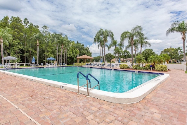 pool featuring a patio area and a gazebo