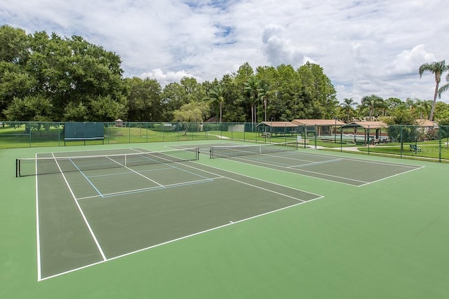 view of sport court with fence