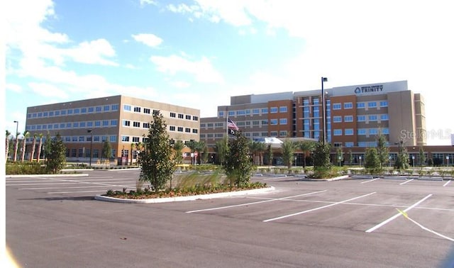 view of property featuring uncovered parking