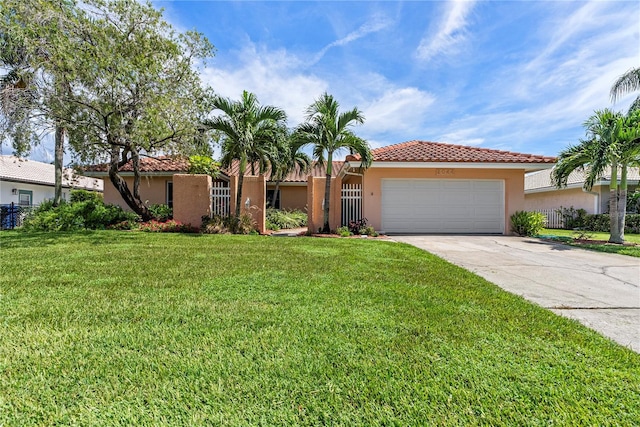 view of front of property with a garage, concrete driveway, a tile roof, a front lawn, and stucco siding