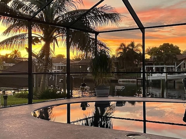 2044 Montana Ave NE, Saint Petersburg, FL 33703 - outdoor pool featuring glass enclosure and a patio