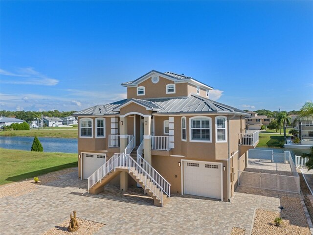 view of front of property featuring a garage and covered porch