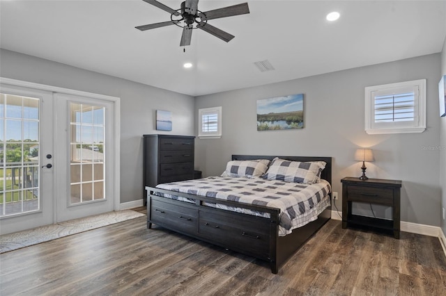 bedroom featuring dark hardwood / wood-style flooring, french doors, access to exterior, and ceiling fan