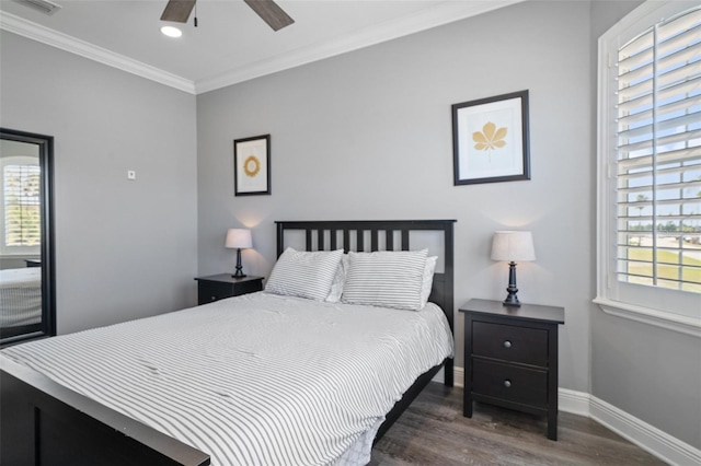 bedroom with multiple windows, ornamental molding, ceiling fan, and wood-type flooring