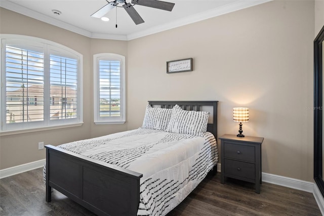 bedroom with ceiling fan, crown molding, and dark hardwood / wood-style flooring