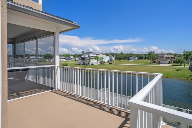 balcony featuring a water view