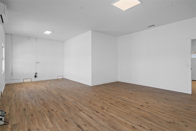 spare room with wood-type flooring