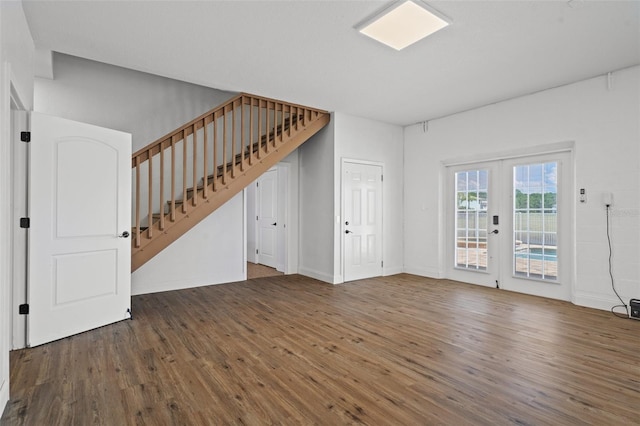 interior space with wood-type flooring and french doors