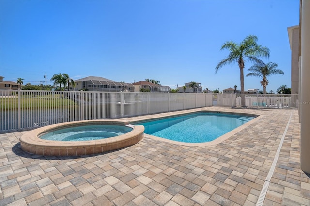 view of pool featuring an in ground hot tub and a patio area