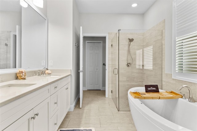 bathroom featuring independent shower and bath, tile patterned flooring, vanity, and tile walls