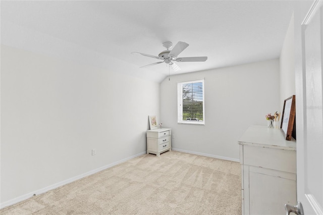 unfurnished bedroom with light colored carpet and ceiling fan