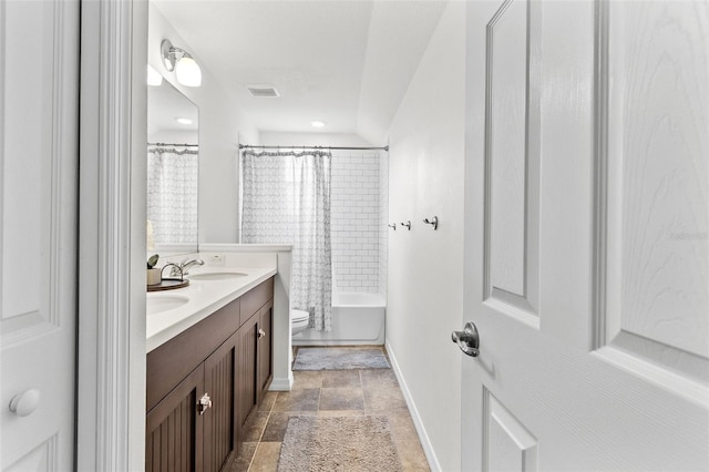 full bathroom featuring vanity, toilet, and shower / tub combo