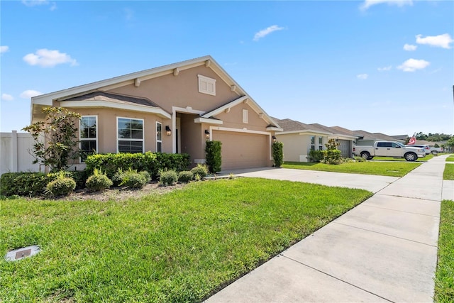 view of front of property with a garage and a front lawn