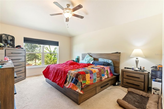 bedroom featuring ceiling fan and light colored carpet