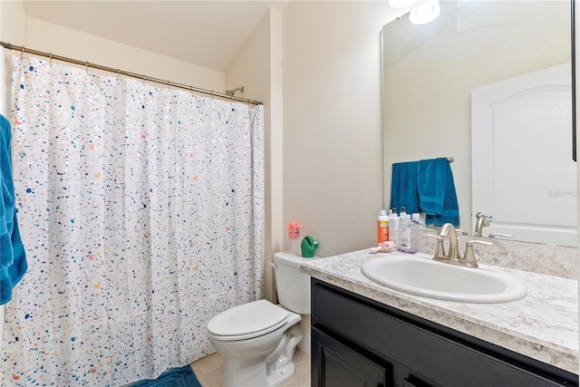 bathroom featuring vanity, toilet, and curtained shower