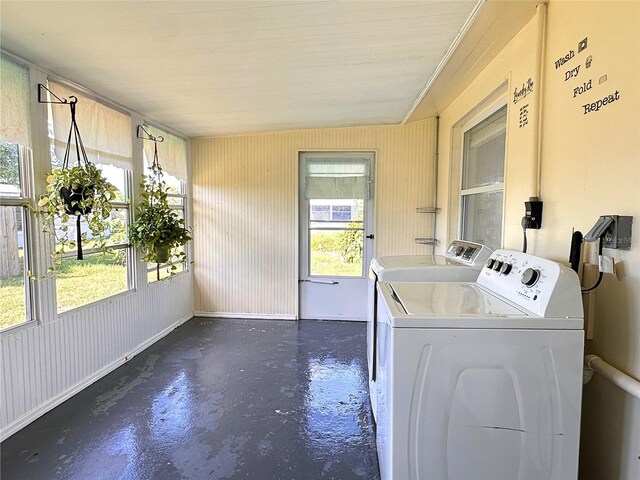 washroom with washing machine and clothes dryer