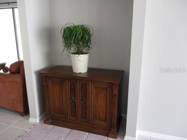 interior details featuring tile patterned flooring