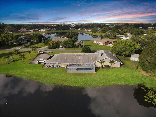 aerial view at dusk with a water view