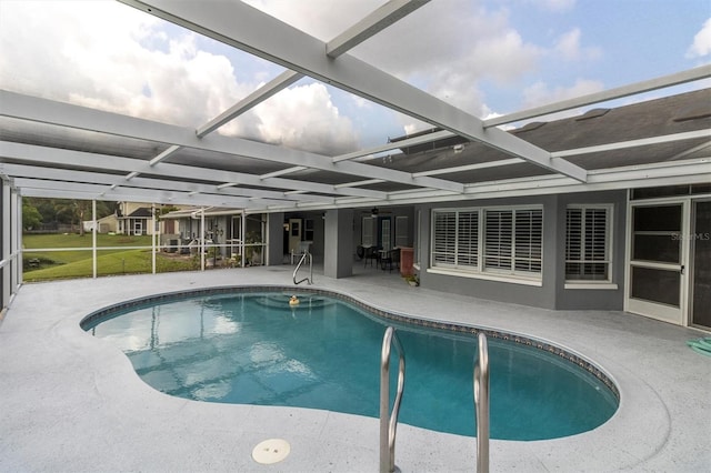 view of swimming pool with a lanai and a patio