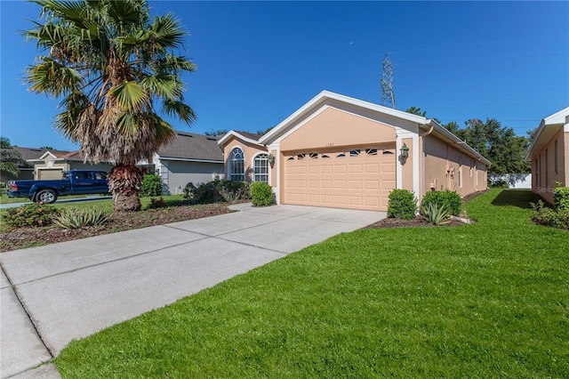 ranch-style home featuring a front yard, a garage, concrete driveway, and stucco siding