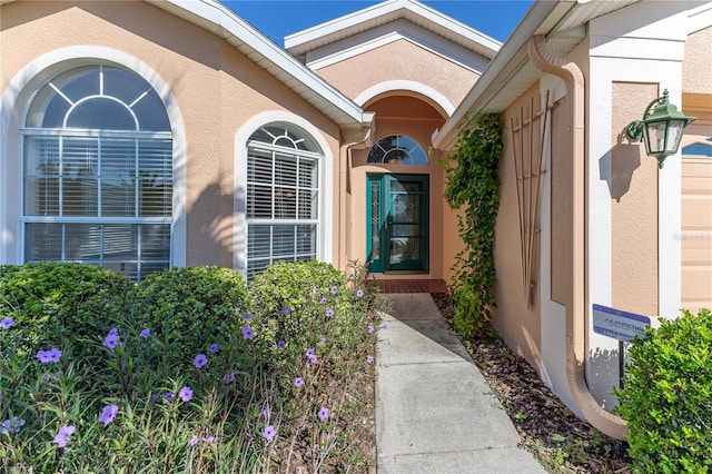 property entrance featuring stucco siding
