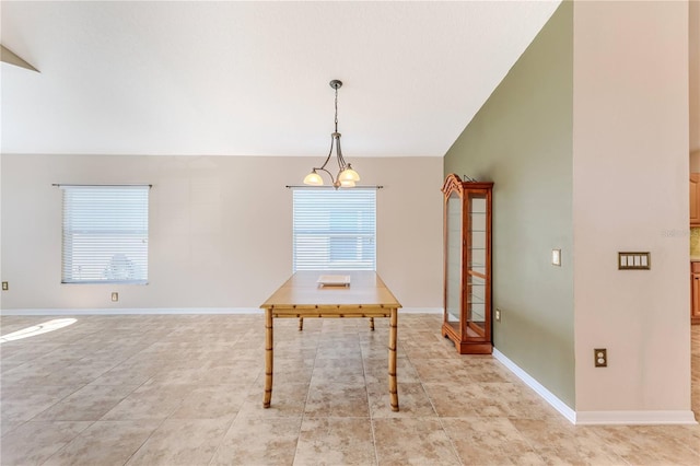 unfurnished dining area featuring light tile patterned flooring, baseboards, and vaulted ceiling