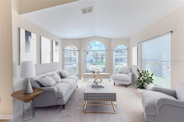 living room featuring carpet flooring, baseboards, and visible vents