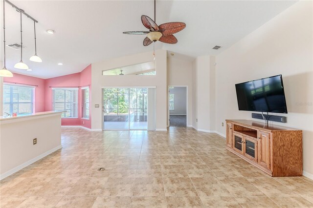 unfurnished living room with ceiling fan, visible vents, and a wealth of natural light