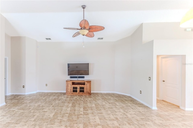 unfurnished living room with ceiling fan and tile patterned floors