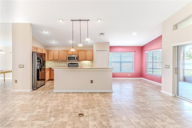 kitchen with light countertops, vaulted ceiling, black fridge, stainless steel microwave, and backsplash