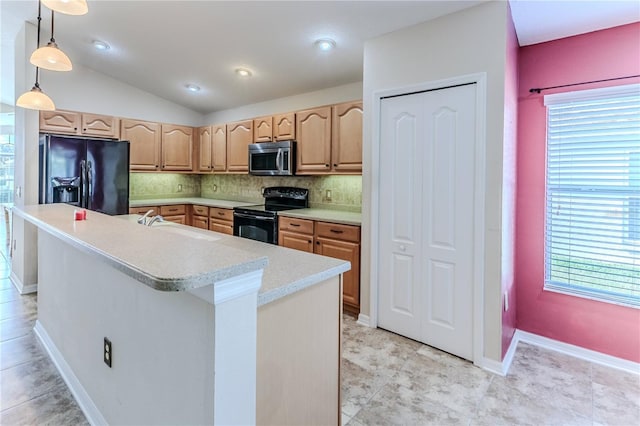 kitchen featuring light countertops, black appliances, vaulted ceiling, and tasteful backsplash