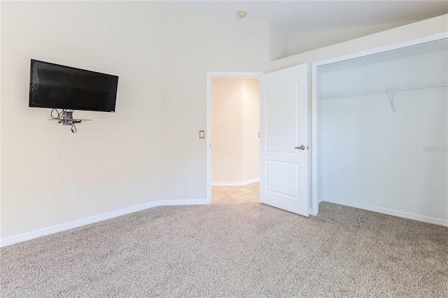 unfurnished bedroom featuring light colored carpet