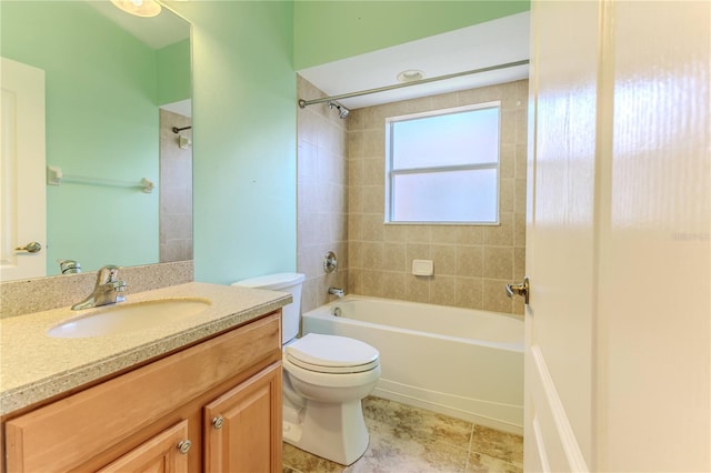 bathroom featuring toilet, vanity,  shower combination, and tile patterned floors