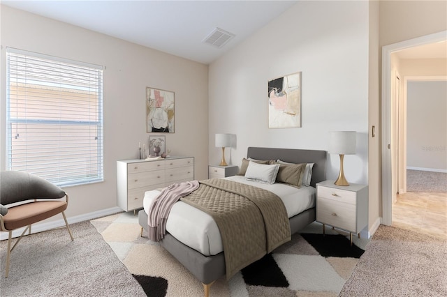 bedroom featuring light carpet