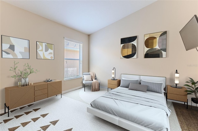 carpeted bedroom with baseboards and vaulted ceiling
